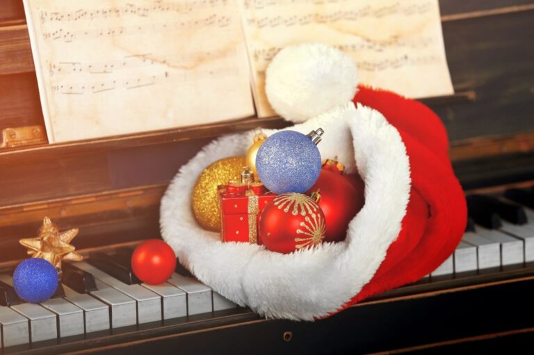 Christmas hat and decorations on a piano